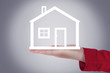 Woman hands holding house