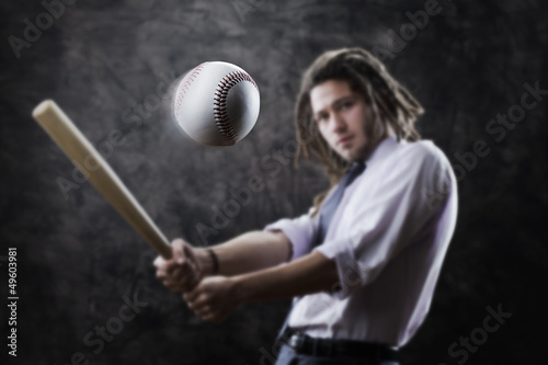 Photo: Businessman swinging baseball bat Businessman swinging baseball bat