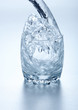 Water flowing into glass