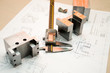 Caliper and finished parts on drawing