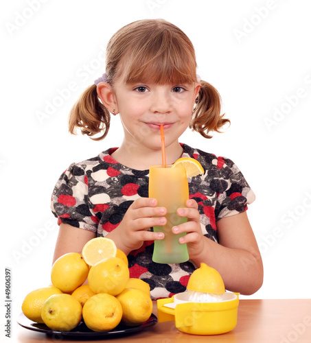 Photo: beautiful little girl drink lemonade beautiful little girl drink lemonade