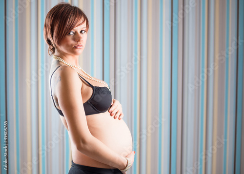 Photo: Standing pregnant woman Standing pregnant woman