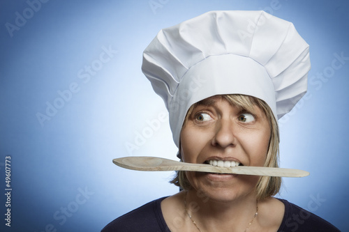 Photo: biting a wooden spoon biting a wooden spoon