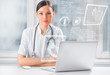 Doctor with hightech computer screen viewing patient data