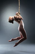 Slim young woman binded with shibari rope