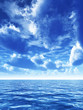 Illustration: cloudy blue sky above a blue surface of the sea cloudy blue sky above a blue surface of the sea