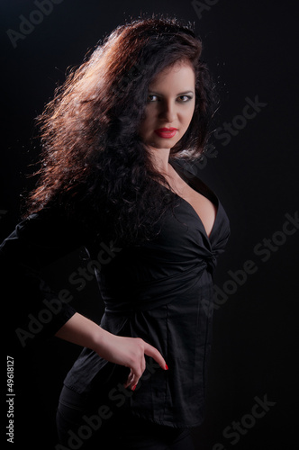 Photo: desired brunette woman posing in leather corset desired brunette woman posing in leather corset