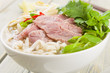 Pho Bo - Vietnamese rice noodle soup with beef, herbs and chili