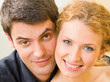 Cheerful smiling young couple, indoors