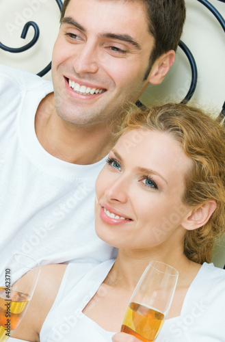 Photo: Cheerful couple with champagne Cheerful couple with champagne