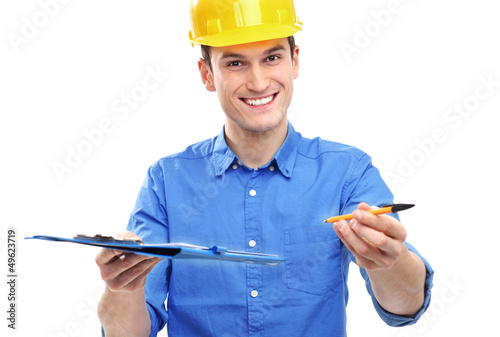 Photo: Engineer with pen and clipboard Engineer with pen and clipboard