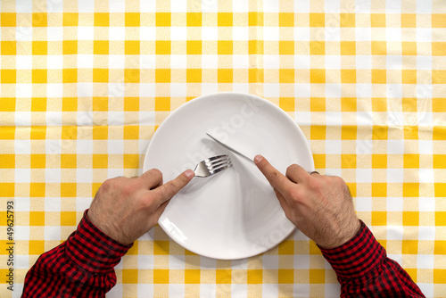 Photo: Hungry man at the dinner table Hungry man at the dinner table
