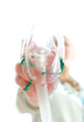 Photo: Female assisitant giving gas mask to patient Female assisitant giving gas mask to patient