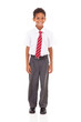 Foto: cute elementary schoolboy in uniform isolated on white cute elementary schoolboy in uniform isolated on white