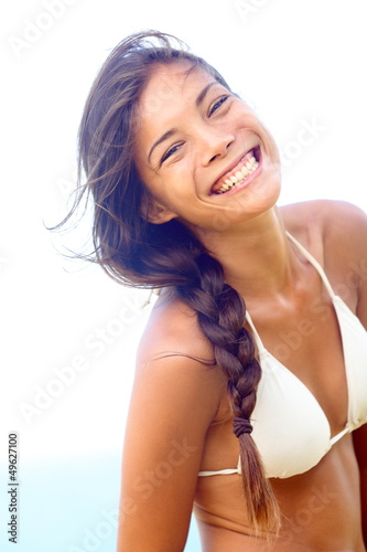 Photo: Happy people - joyful smiling woman in bikini Happy people - joyful smiling woman in bikini