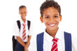 cute elementary schoolboy in front of classmate