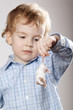 little boy plays with mouse
