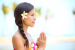 Serene meditation - meditating woman on beach