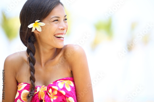 Photo: Beach woman happy looking to side laughing Beach woman happy looking to side laughing