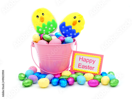 Photo: Happy Easter tag and pink pail filled with colorful candy Happy Easter tag and pink pail filled with colorful candy