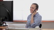Video: Woman talking on cellphone in front of the computer Woman talking on cellphone in front of the computer