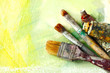 Artists brushes on an abstract artistic background