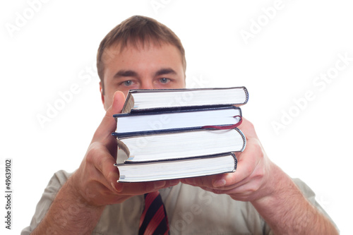Photo: Man holding books. Man holding books.