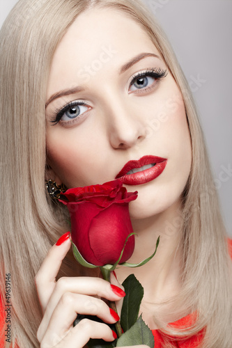 Photo: blonde woman with rose blonde woman with rose