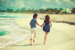 Lovers running along the coastline