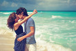 Beautiful Kissing couple near the ocean