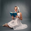 Photo: Retro woman with sunglasses reading book portrait Retro woman with sunglasses reading book portrait