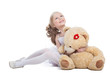 Photo: Beautiful little girl hugging big teddy bear Beautiful little girl hugging big teddy bear