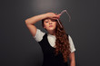 tired young woman holding glasses