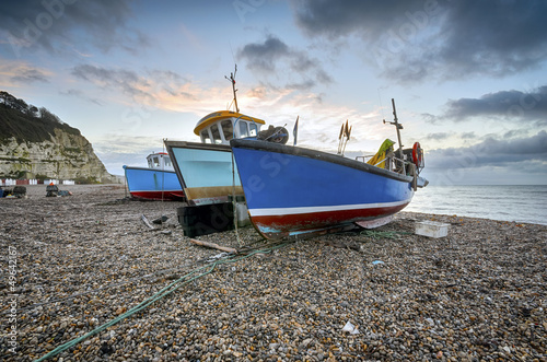 Photo: Fishing boats on the beach at Beer in Devon Fishing boats on the beach at Beer in Devon