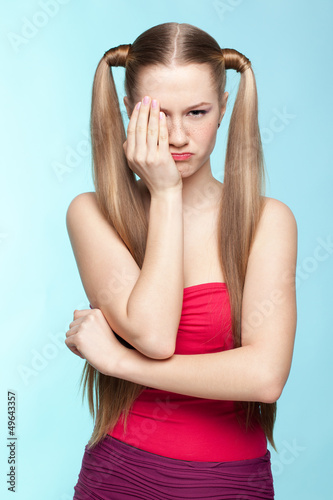 Photo: Upset Freckled girl in red dress Upset Freckled girl in red dress