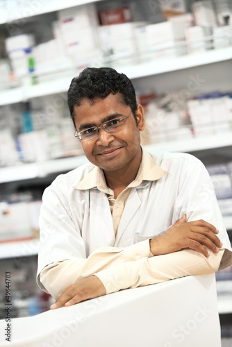 Photo: Pharmacy chemist woman in drugstore Pharmacy chemist woman in drugstore