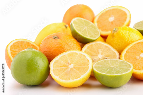 Photo: heap of orange, green and yellow lemon heap of orange, green and yellow lemon