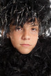 Photo: Young girl in feather boa Young girl in feather boa