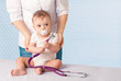 Photo: Doctor and baby patient. Doctor and baby patient.