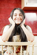Funny brunette woman sitting on chair