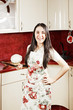 Happy housewife with frying pan