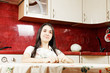 Serene woman in kitchen