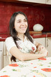 Smiling woman in kitchen
