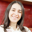 Smiling woman against red