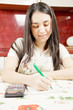 Smiling housewife making notes