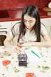 Serious woman making calculations