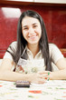 Photo: Happy housewife making notes Happy housewife making notes