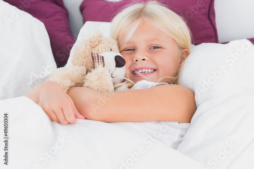 Photo: Little girl embracing her cuddly toy Little girl embracing her cuddly toy