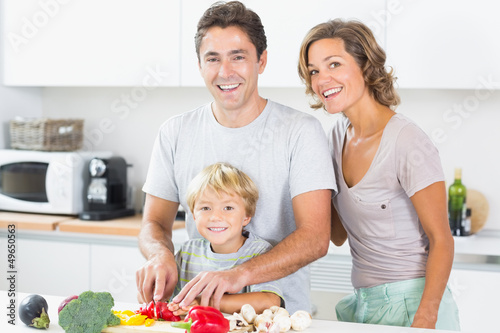 Photo: Happy family preparing vegetables Happy family preparing vegetables