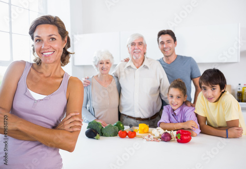 Photo: Mother standing beside kitchen counter Mother standing beside kitchen counter